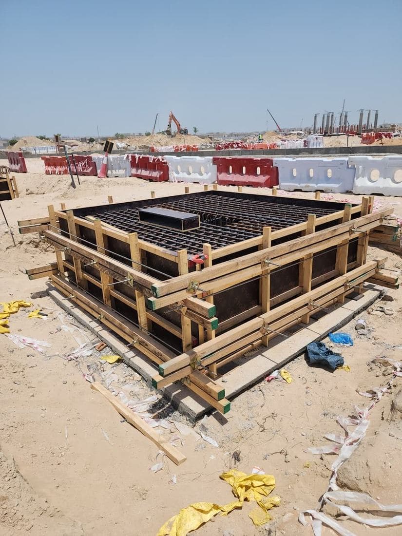 In-situ reinforced concrete chamber — wall formwork erected and top-slab reinforcement fixed, ready for pour.