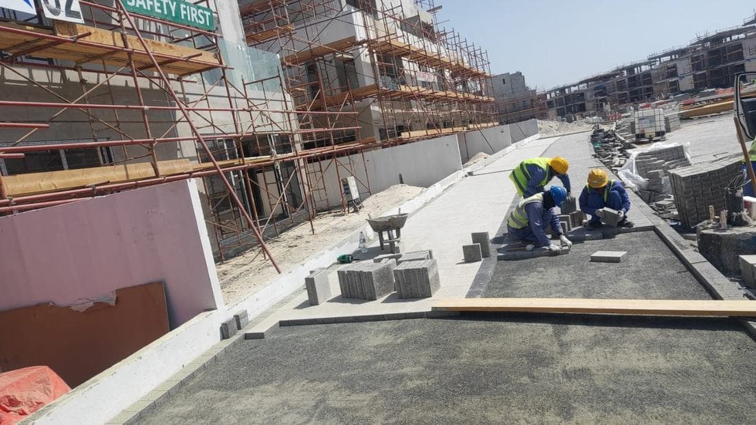 Paver, kerbstone and banding installation to a screeded bed — Al Reem Island.